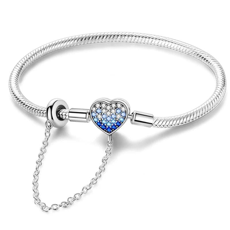 Pulsera con dije de corazón con cristales degradados azules y cadena de seguridad